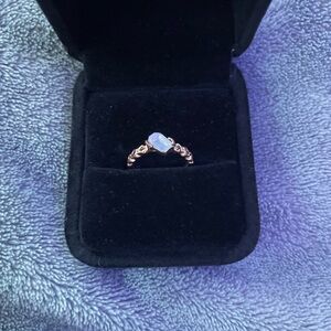 Gold Engagement Ring with Clear Center Stone and Accent Diamonds